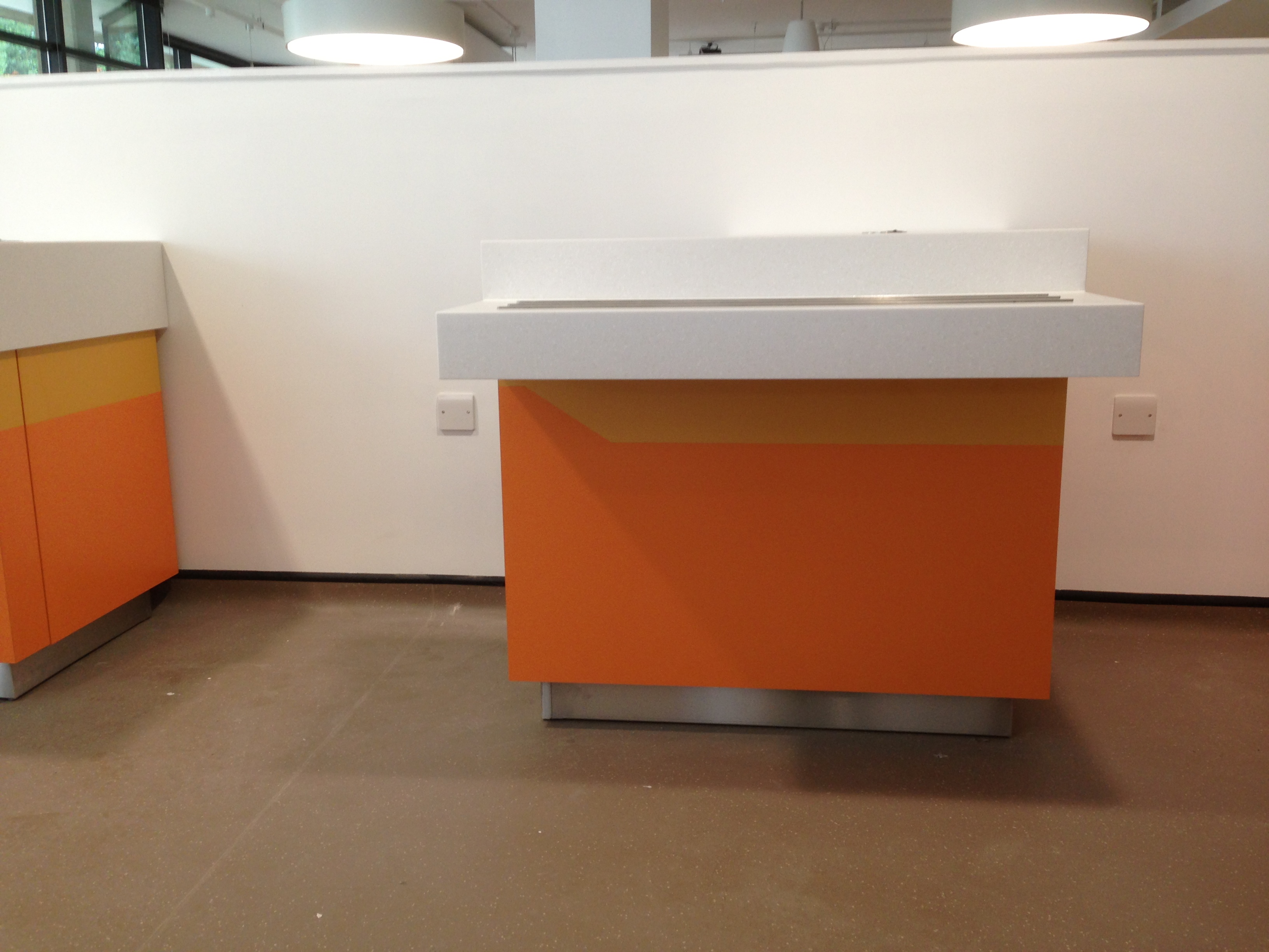University -  Birmingham White solid surface worktops with stainless steel tray runners and two tone laminated fascia
