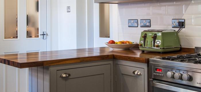 Bespoke hand painted traditional kitchen with American black walnut worktops and upstands