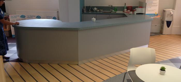 Coffee bar reception – Warrington Fascia made up in Mr Mdf with steel formica laminate, plinth made from stainless steel