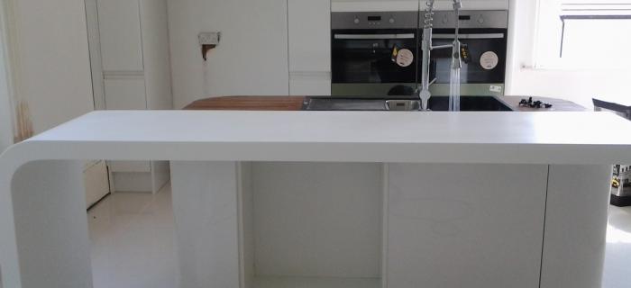 Glacier white corian worktop with formed curved end panels