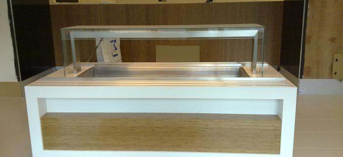 (Addleshaw) Law firm  – London  Glacier white corian and stainless steel tray runners throughout with bamboo veneer impulse displays 
